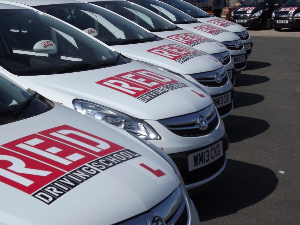 RED Driving school white corsa