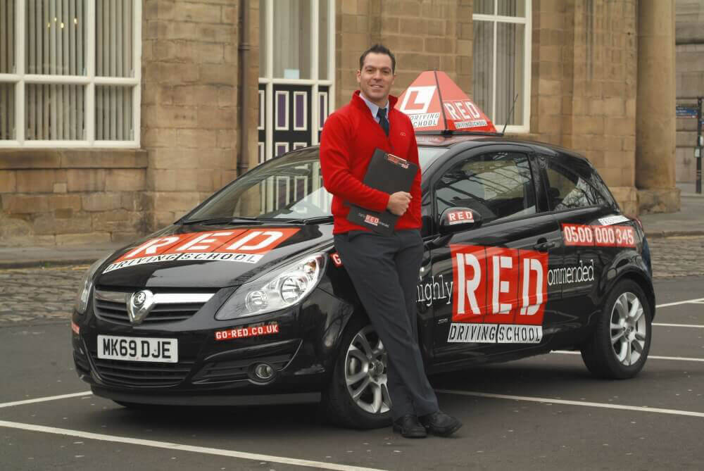 Red Driving school instructor and car