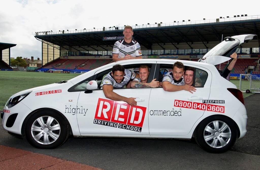 Widness Vikings in RED driving school car