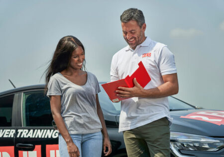 Instructor and female clipboard